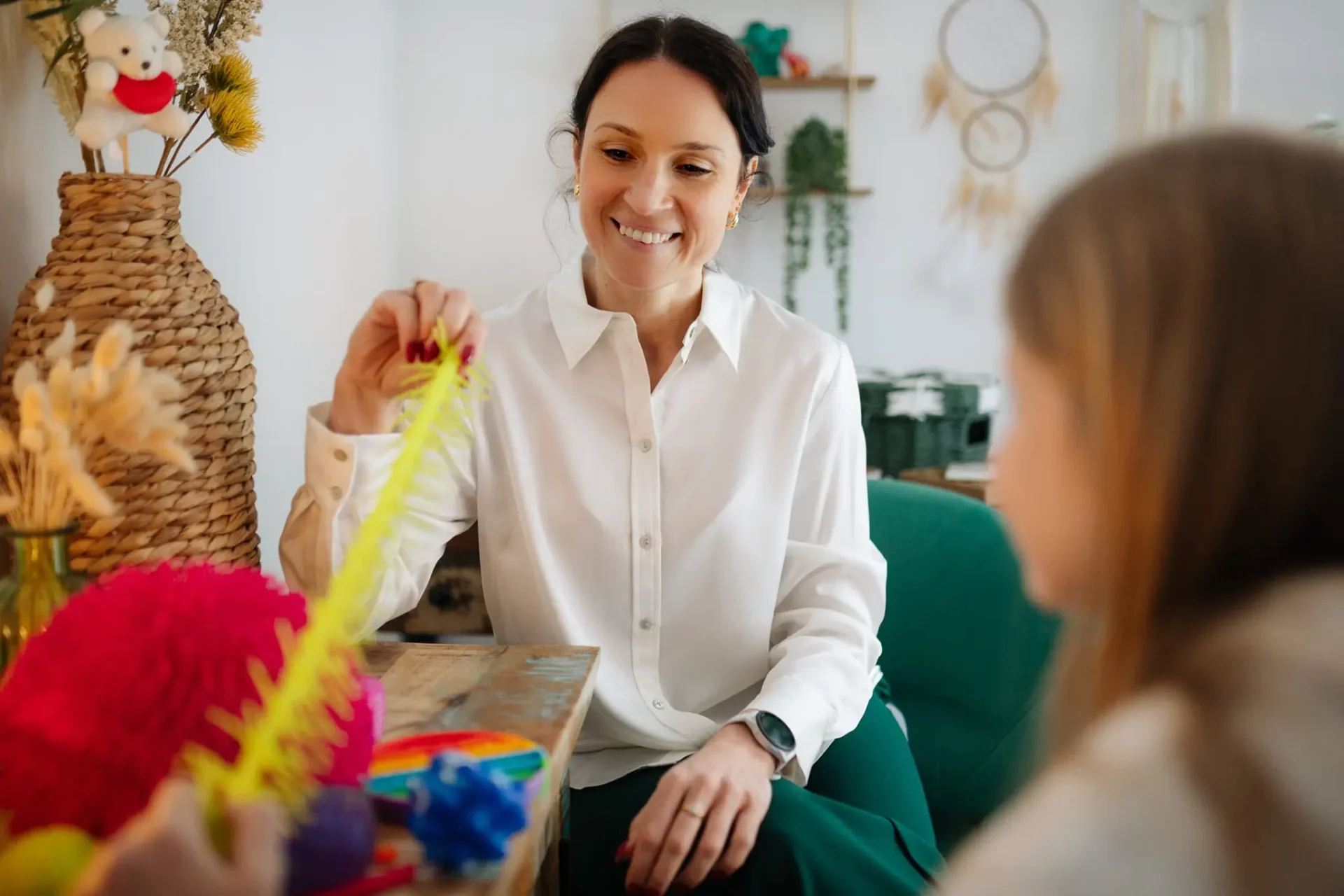 Kam speaking with a client during a counselling session.