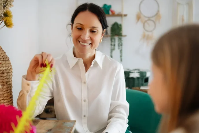Kam speaking with a client during a counselling session.